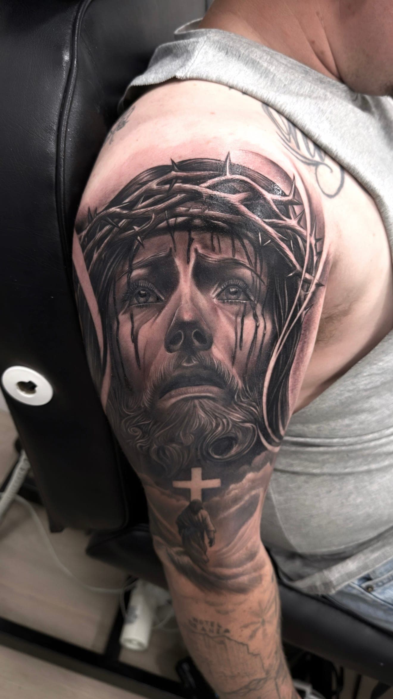 Black and grey realism portrait of Jesus Christ with crown of thorns