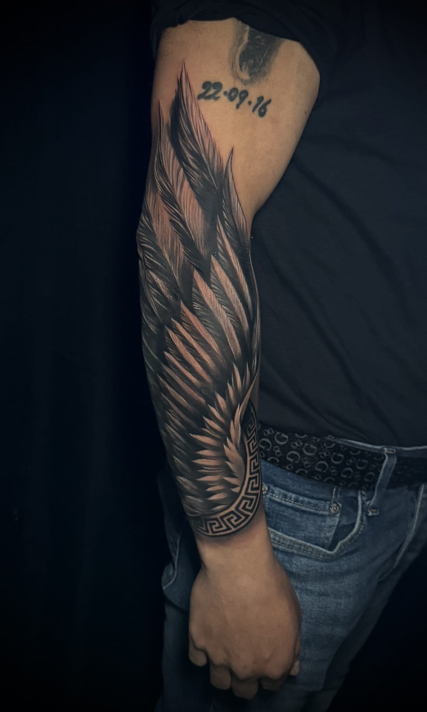 Detailed wing memorial tattoo with date 22-09-16